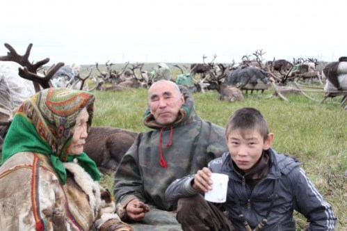 The blind elder Piotr Khudi with his family just before crossing Bovanenkovo gas deposit, Yamal Peninsula