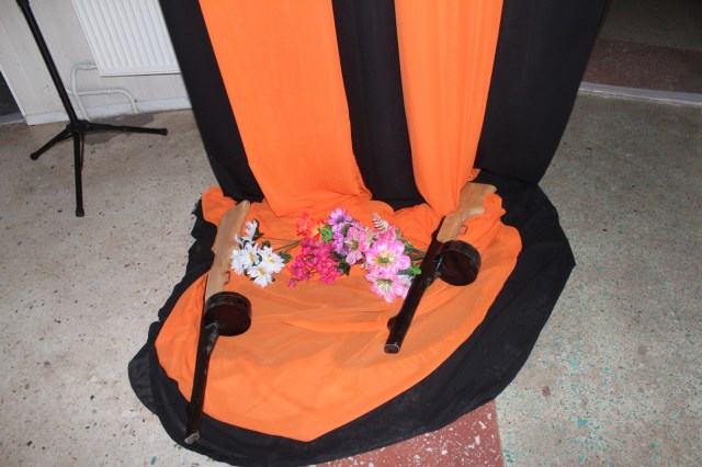 Our exhibition was sided by mock-up guns n' roses on the orange-black background of the St. George's Ribbon, a widespread symbol of commemoration of World War II, the end of which was celebrated in Russia on 9th of May.