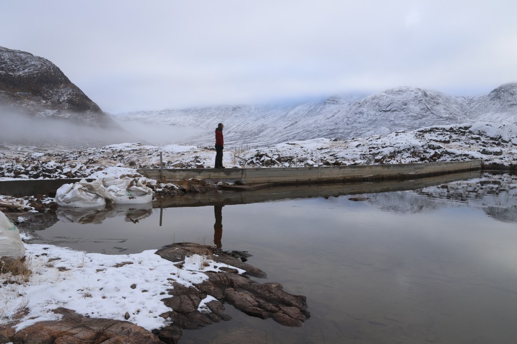 Inspecting the higher dam during construction in November 2025